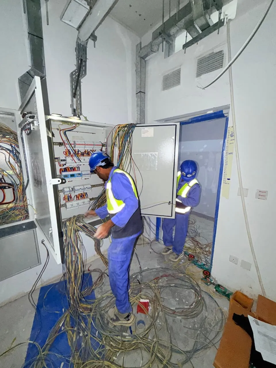 Hilal Al Fajar electrician working on an electrical panel in Dubai